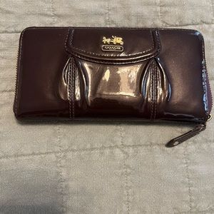 Gently used purple coach paten leather zipper wallet